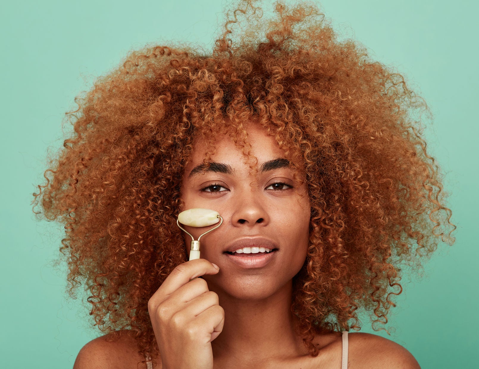 Young natural skin treatment portrait of an African American woman isolated