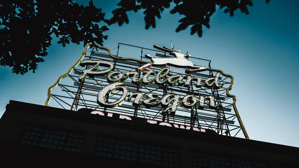 photo of a portland marquee sign on a building against the blue sky
