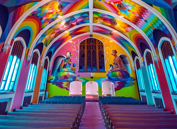 Image of a church with psychedelic, colorful paint on the ceiling and walls.